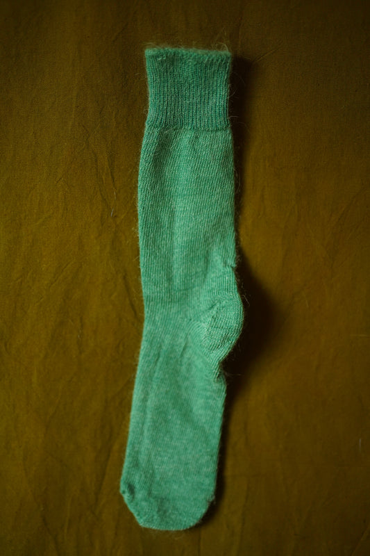 green mohair socks on green background